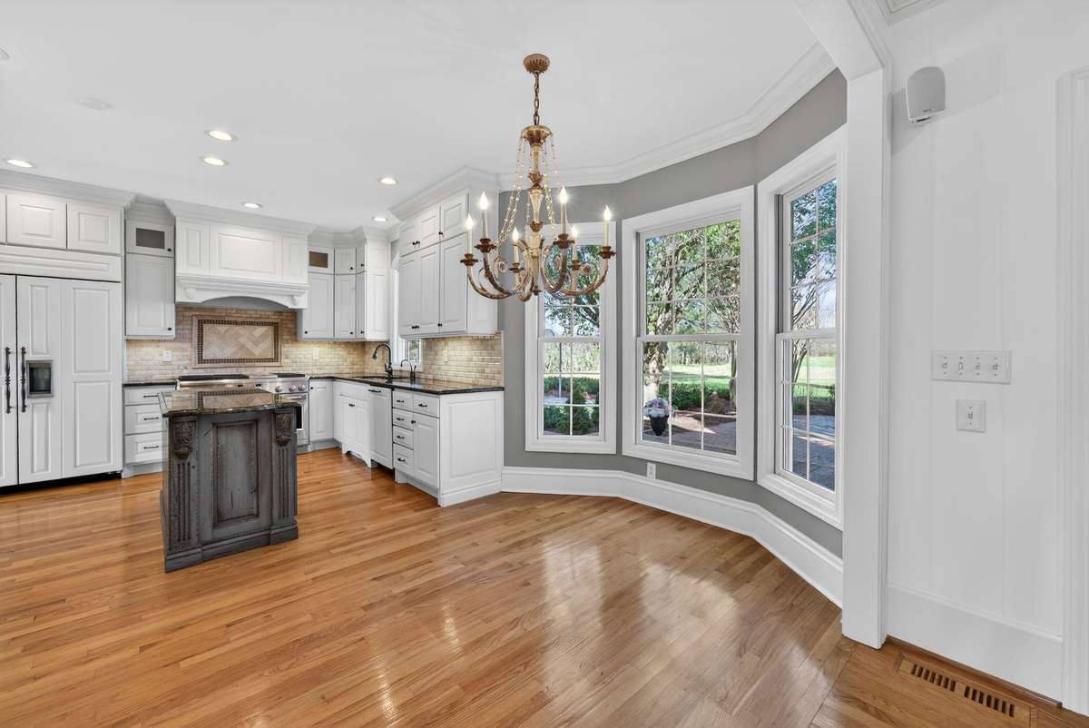 Breakfast nook with bay window offering beautiful views of the patio and fountain.