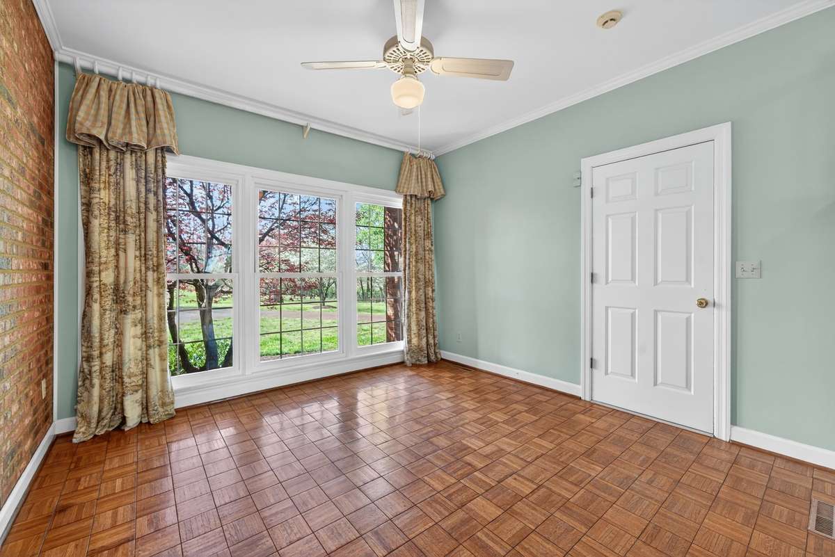 Beautifully versatile, the sunroom also serves as an ideal drop zone near the rear entry.