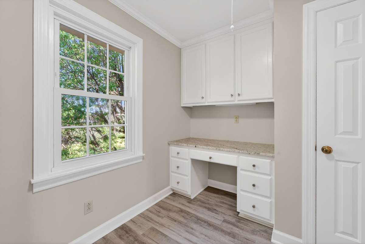 Upstairs utility room with a built-in desk.