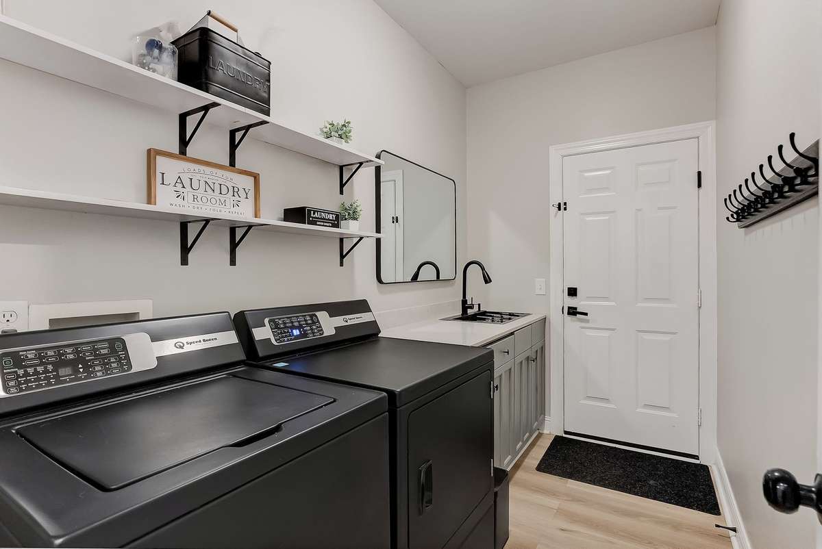 Dedicated laundry room with space for storage and everyday functionality. (Washer and Dryer do not convey)