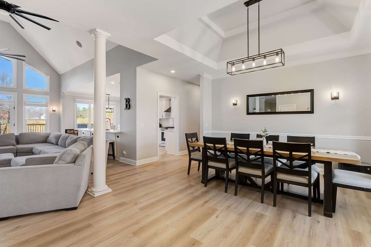 Open-concept design connecting the living room directly to the dining space, creating an ideal setup for entertaining.