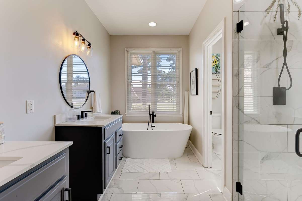 Primary bath featuring dual vanities, ample counter space, and a functional layout designed for daily convenience.
