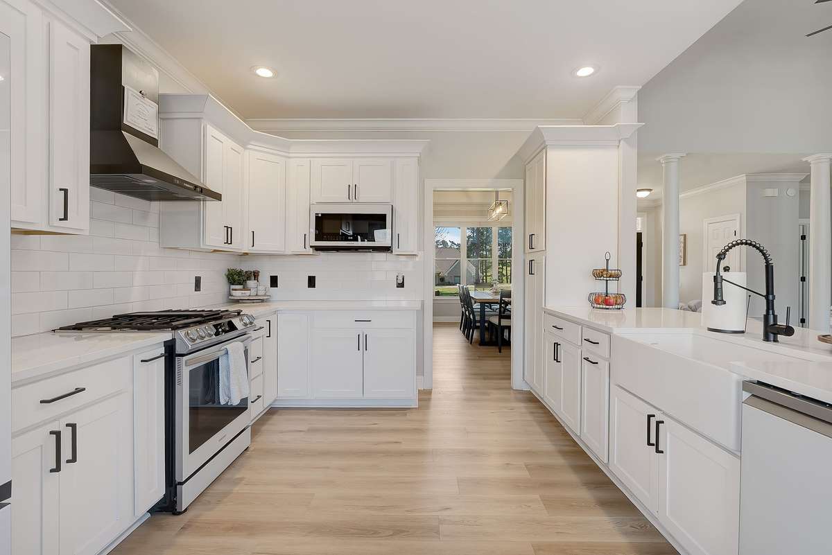 Kitchen with generous counter space, abundant cabinetry, and a functional layout designed for both everyday cooking and hosting.