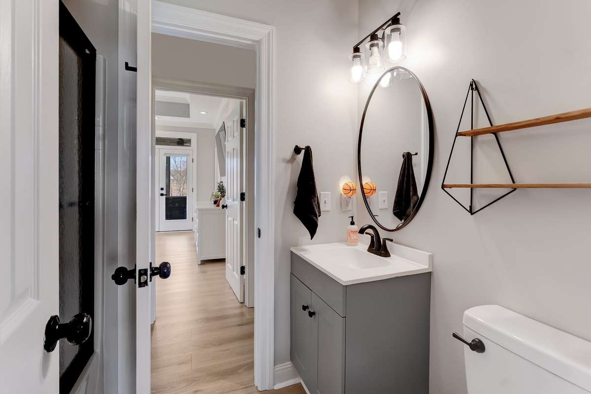 Well-maintained hall bath conveniently located for additional bedrooms and guests.
