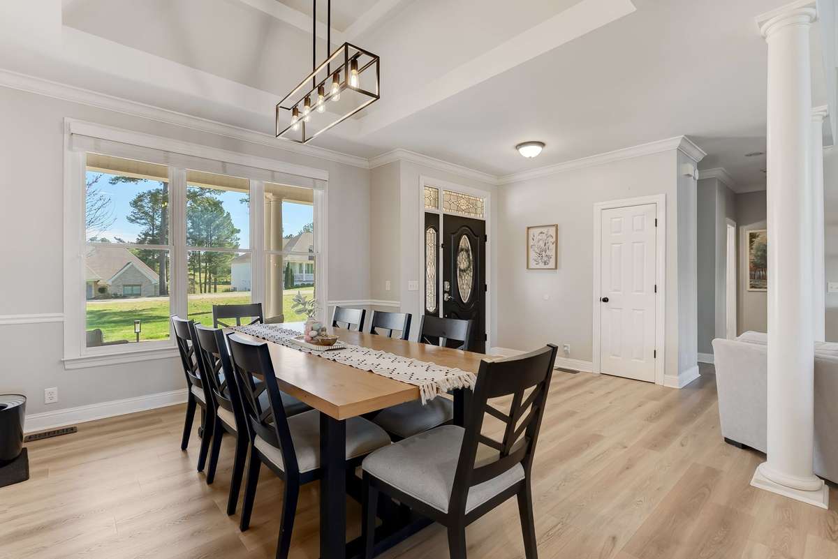 Dedicated dining area with updated lighting and plenty of room for a full-size table, perfect for gatherings.