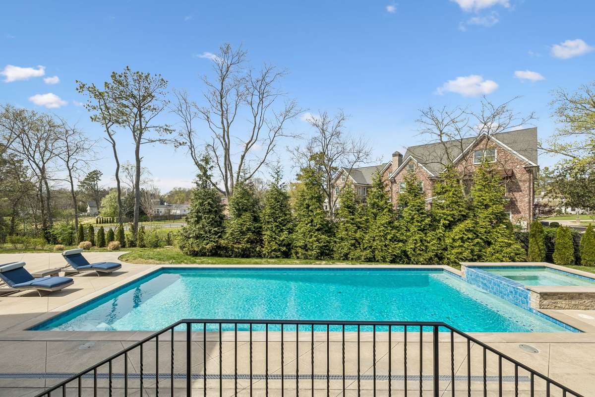 Step outside to your private retreat—complete with a saltwater pool and spa, surrounded by peaceful, landscaped grounds designed for both relaxation and entertaining.