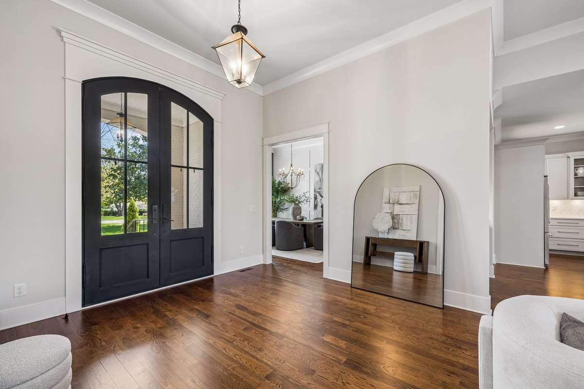 Just beyond, the home begins to unfold in a way that feels intentional at every turn.