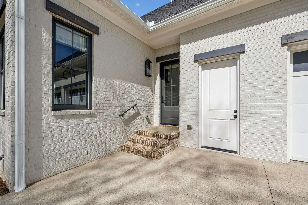 The private entrance off the 3-car garage is perfect for guest use.