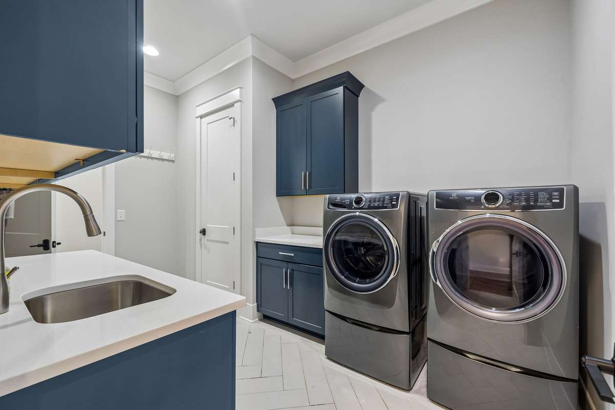 Conveniently located just steps from the laundry room, the primary suite is as functional as it is beautiful.