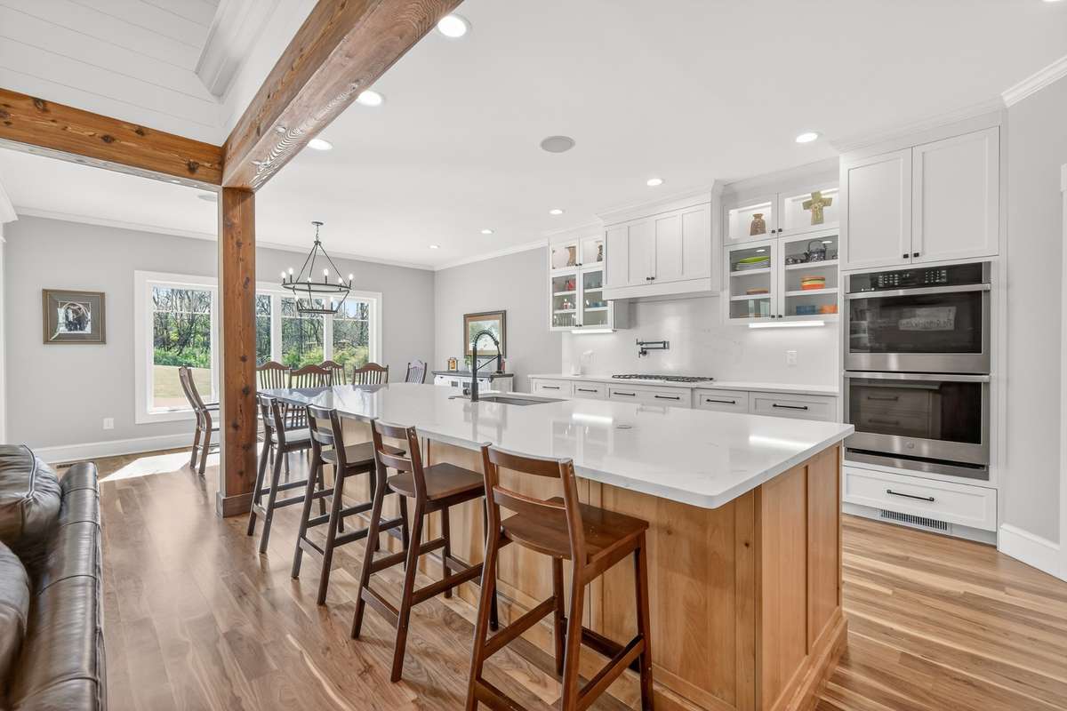 The theme of Country Charm and Modern Elegance continues into this well appointed, eat-in kitchen.