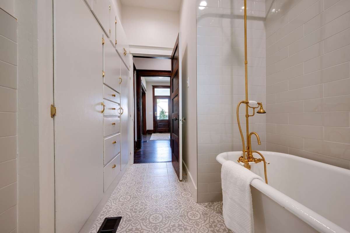 Original Clawfoot Tub Refurbished
All New Tile in Bathrooms