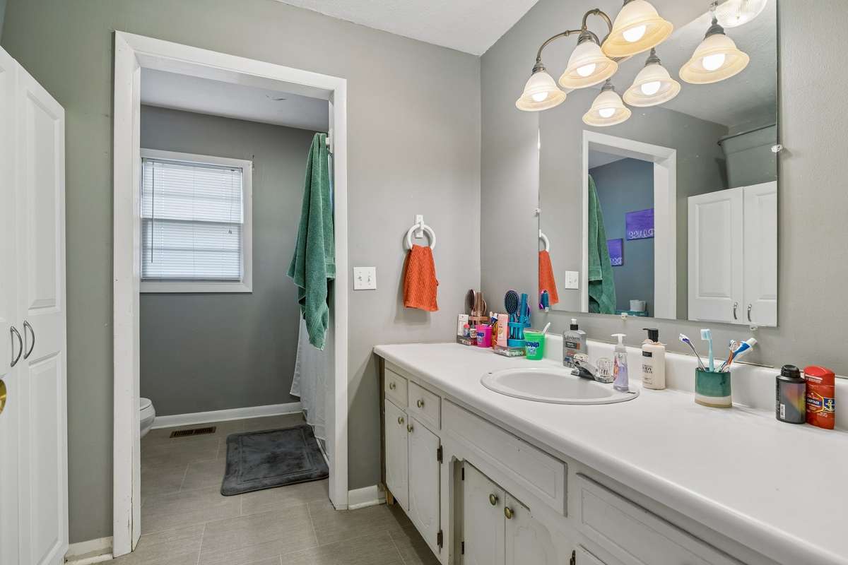 Guest bath features an extra long vanity plus a linen closet! 380 Holiday Haven Rd, Smithville, TN 37166