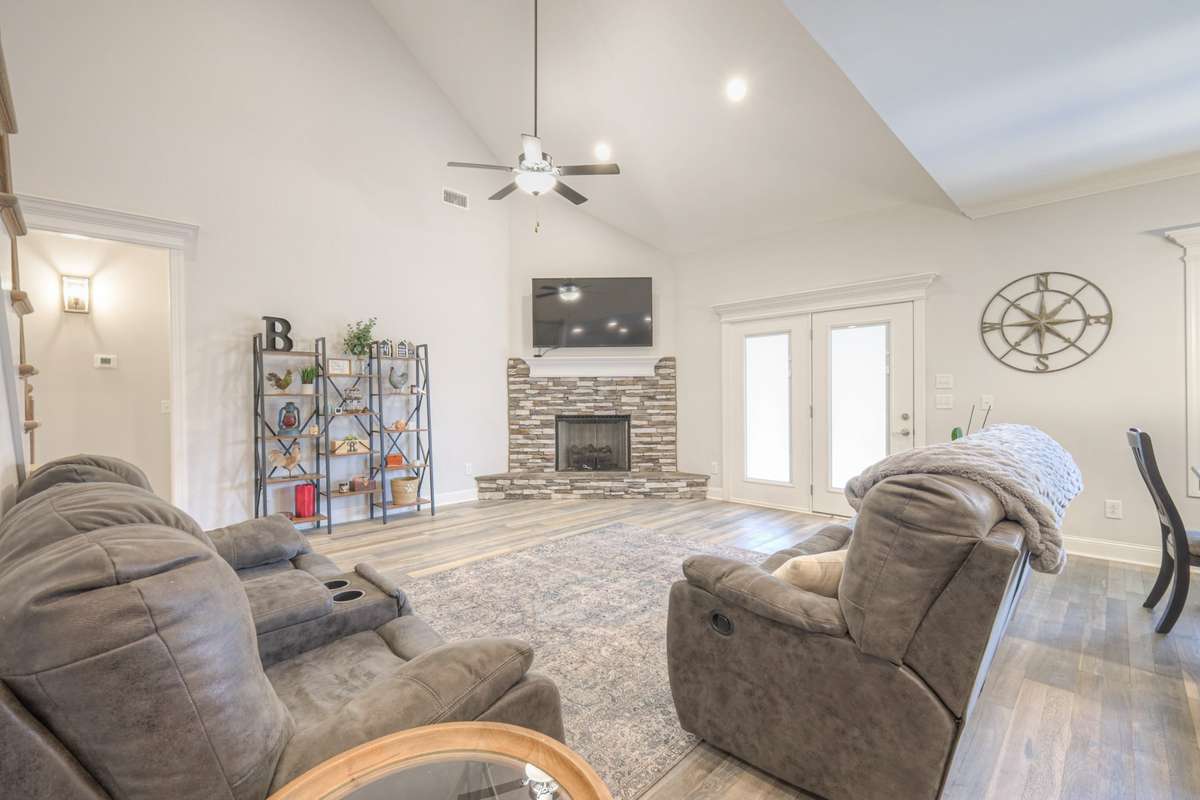 Enjoy high ceilings and natural light as you snuggle by the fire.