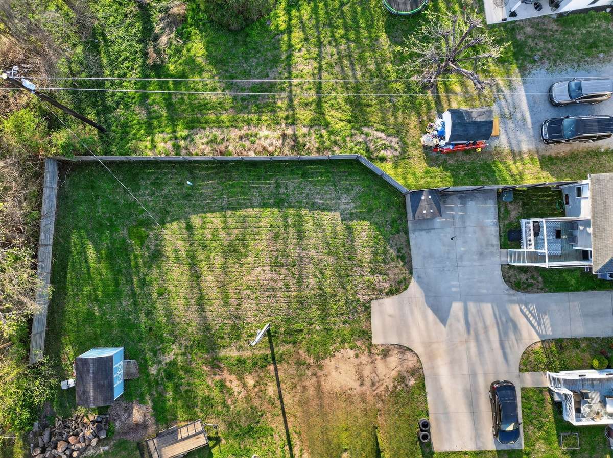 Back yard partially fenced.