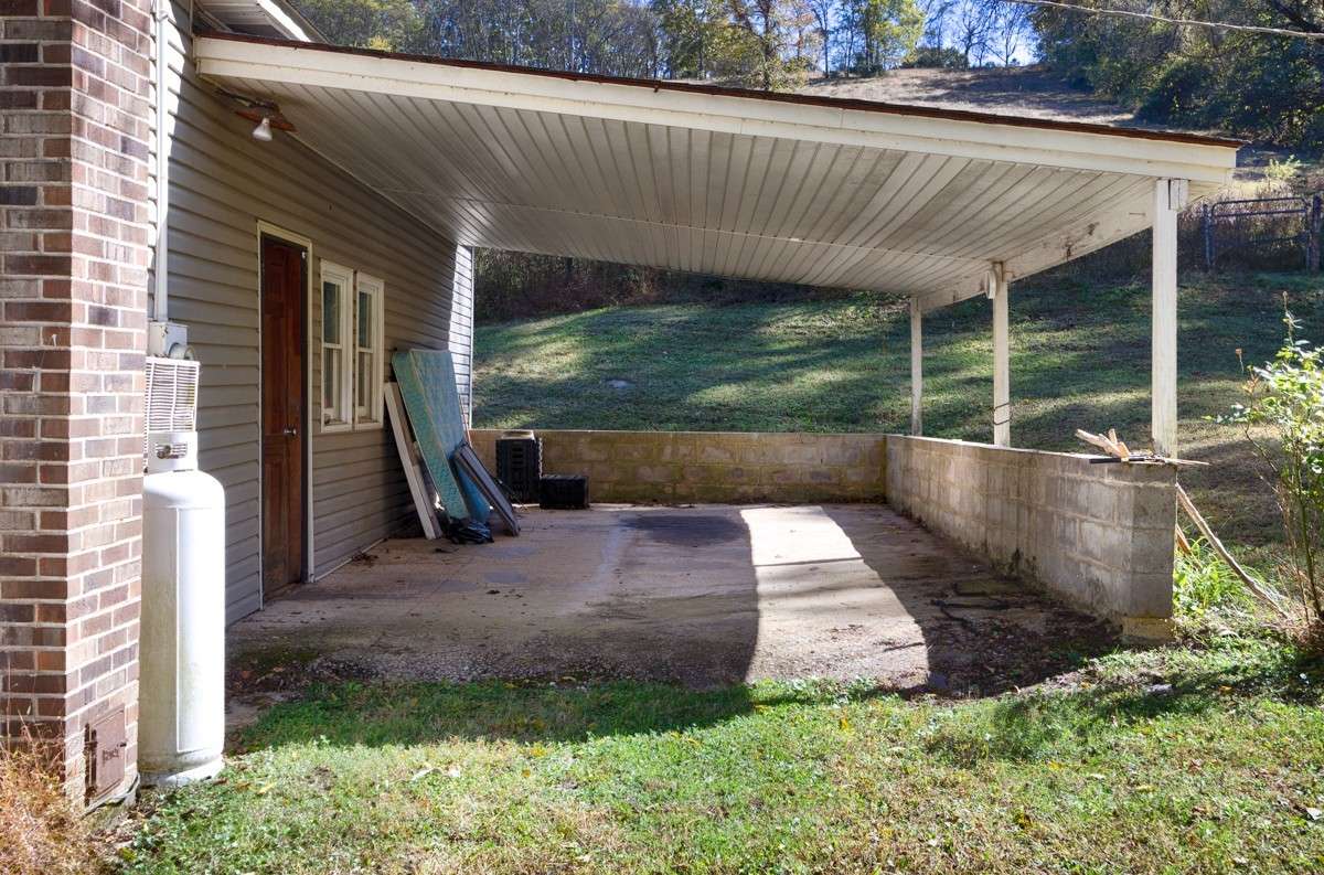 Attached one car carport with home entry
