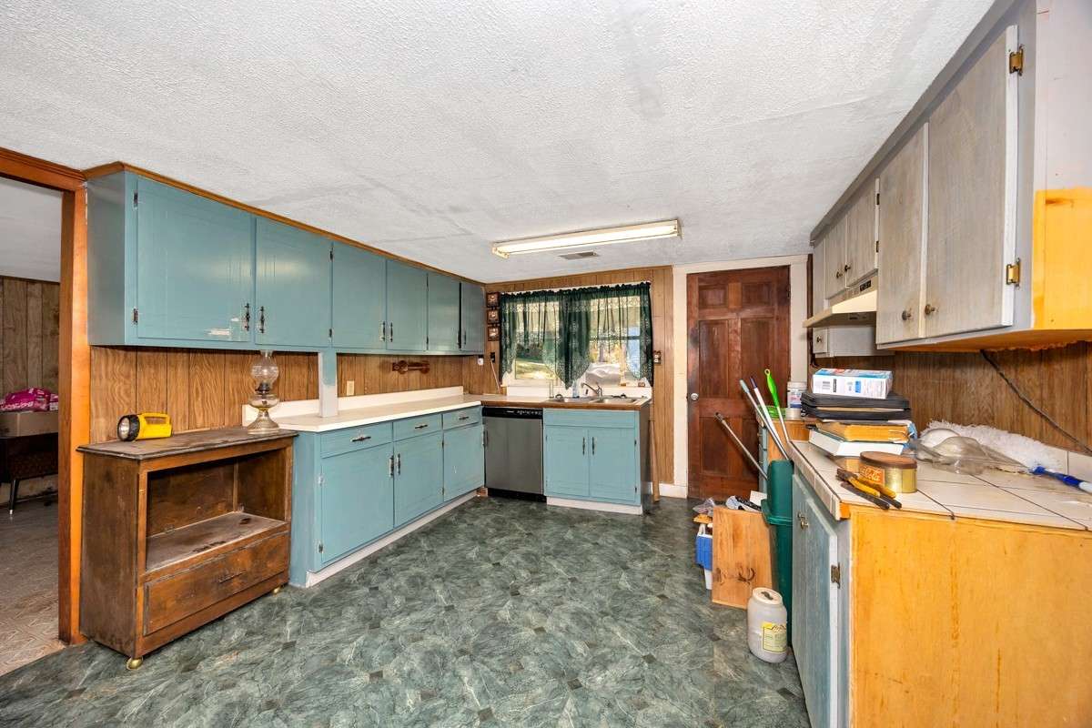 Eat-In Kitchen- vinyl flooring, crown molding