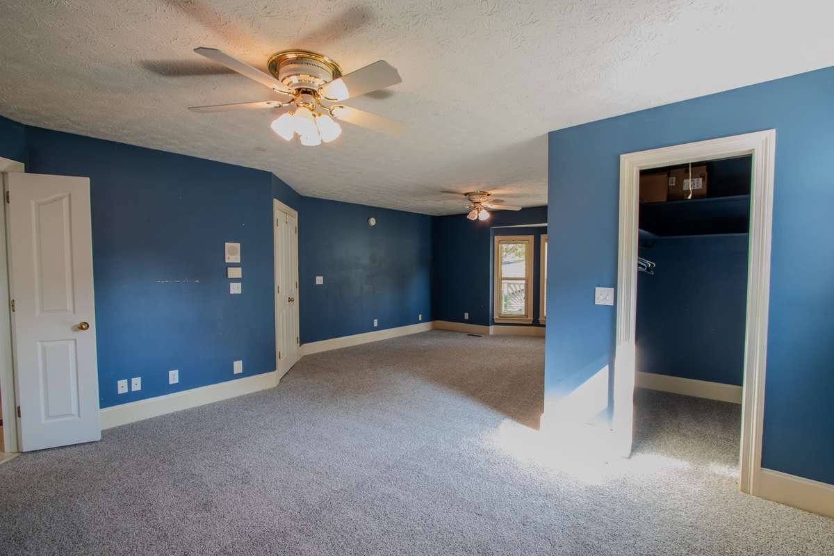 Primary Bedroom. One of two walk in closets.