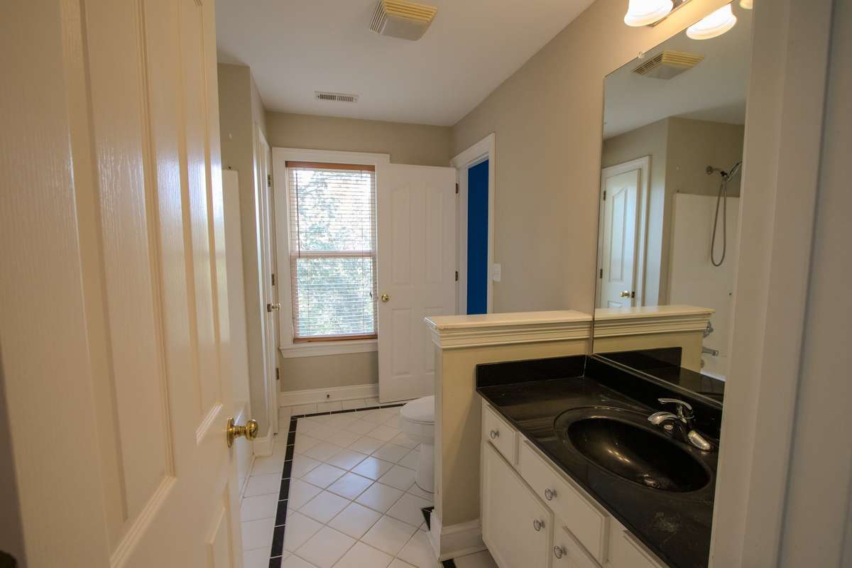 One of two upstairs bathrooms. Shower/tub combo.