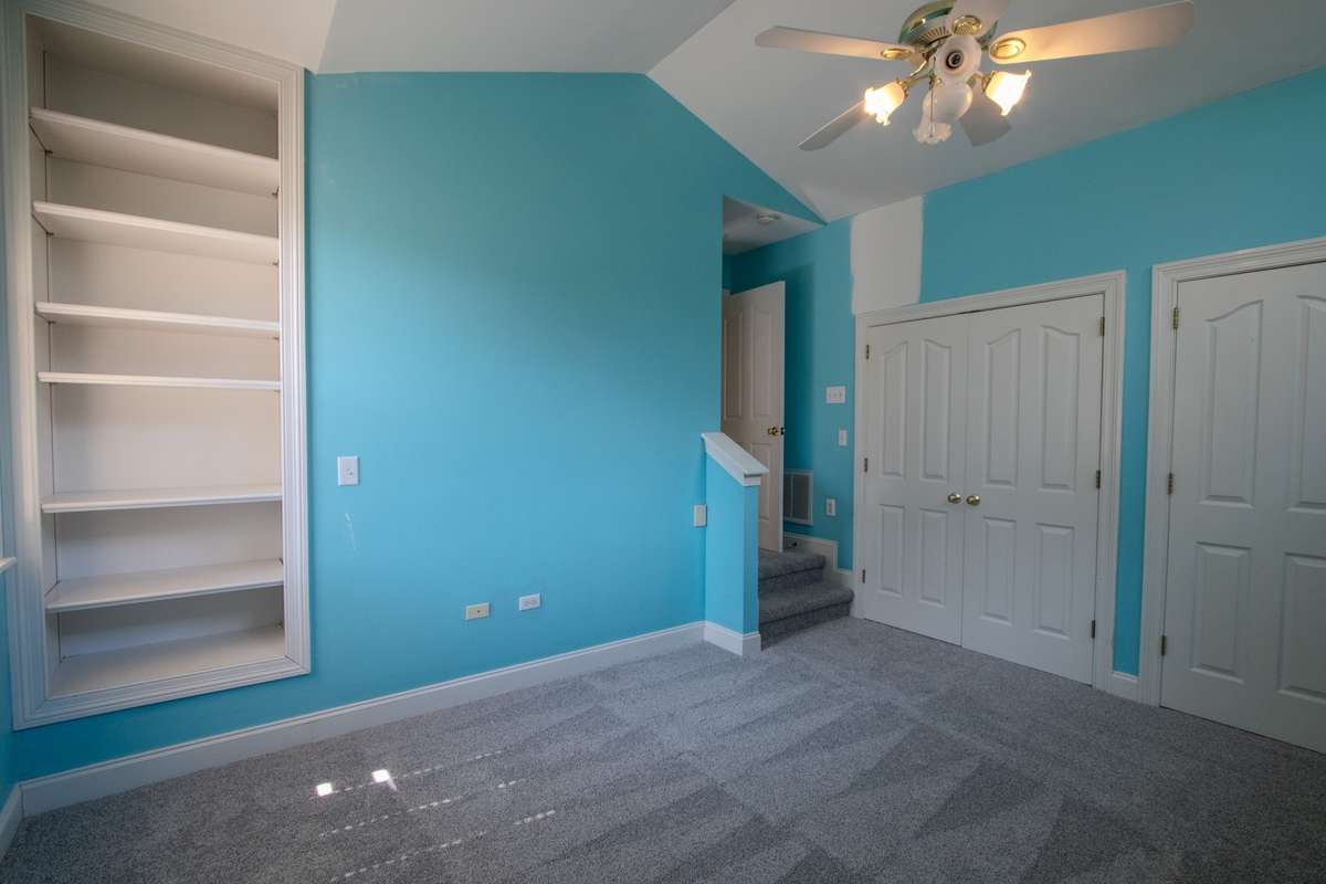 Upstairs bedroom. Tall ceilings, huge closet and additional shelves.