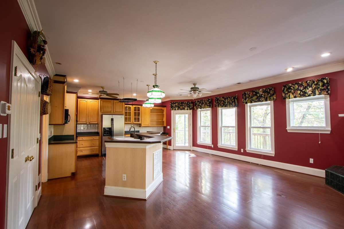 Kitchen has double ovens, stove top, microwave, refrigerator and dishwasher. All remain. A huge pantry is to the right.