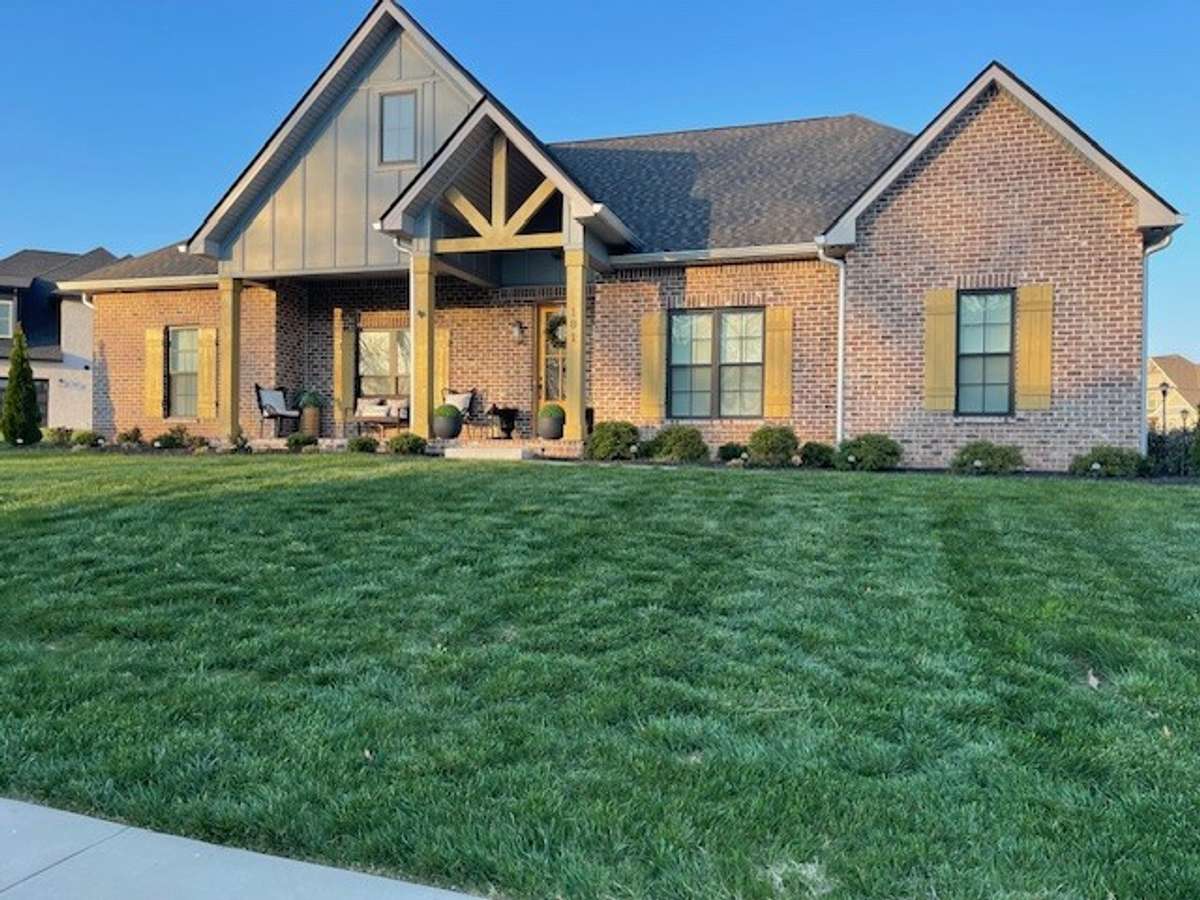 Side View-Professional Landscaping and grass.