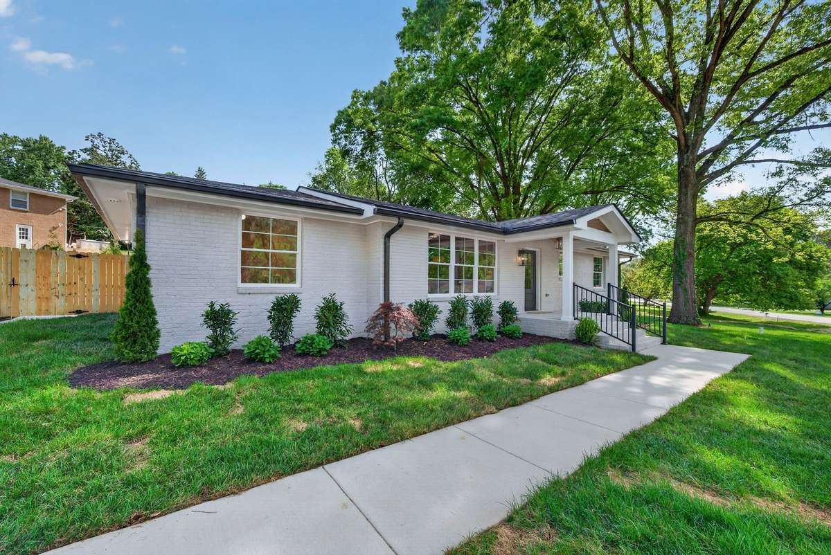 The property sits on a large corner lot with all new landscaping and sod with irrigation and uplighting.