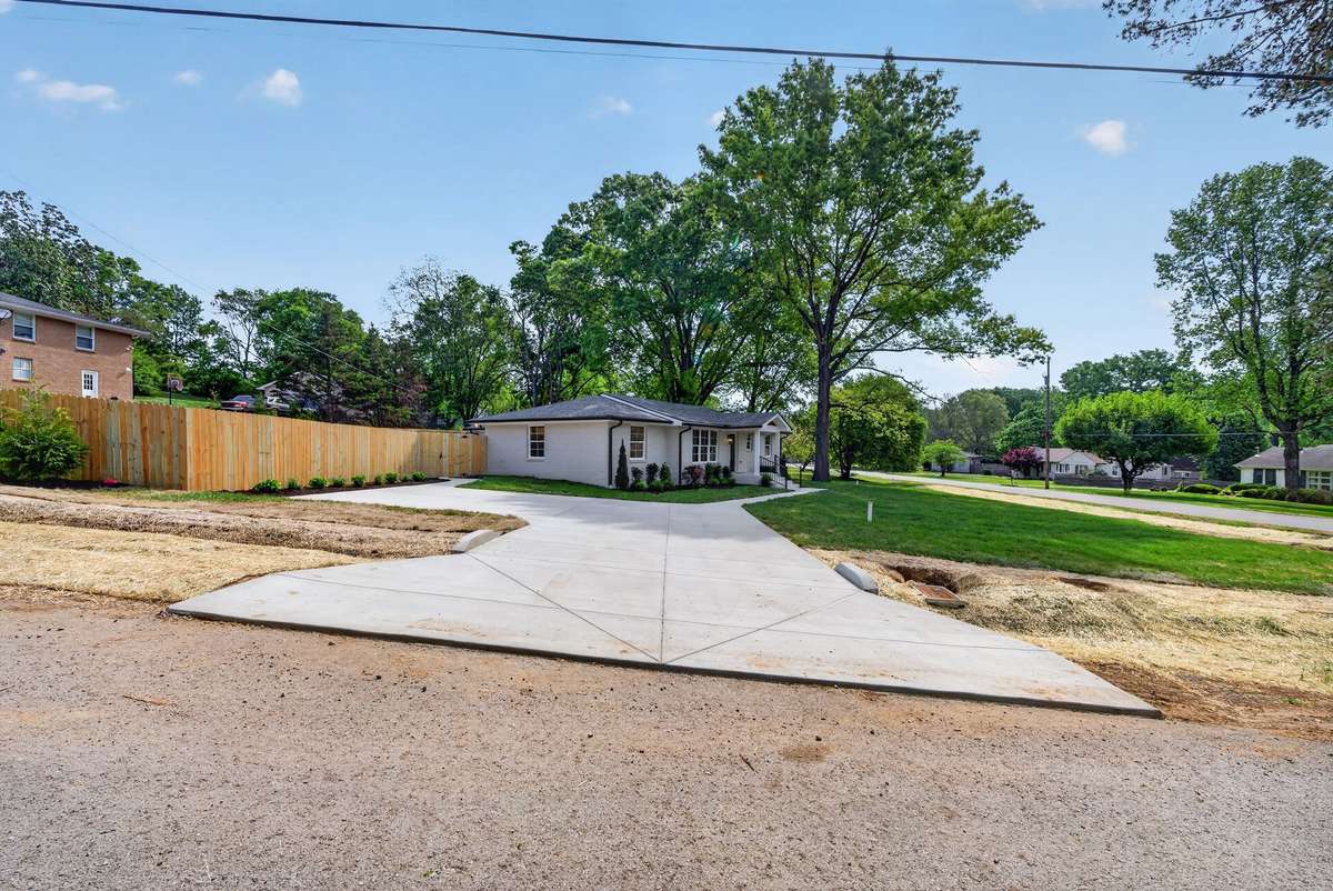 Freshly poured concrete driveway with parking pad