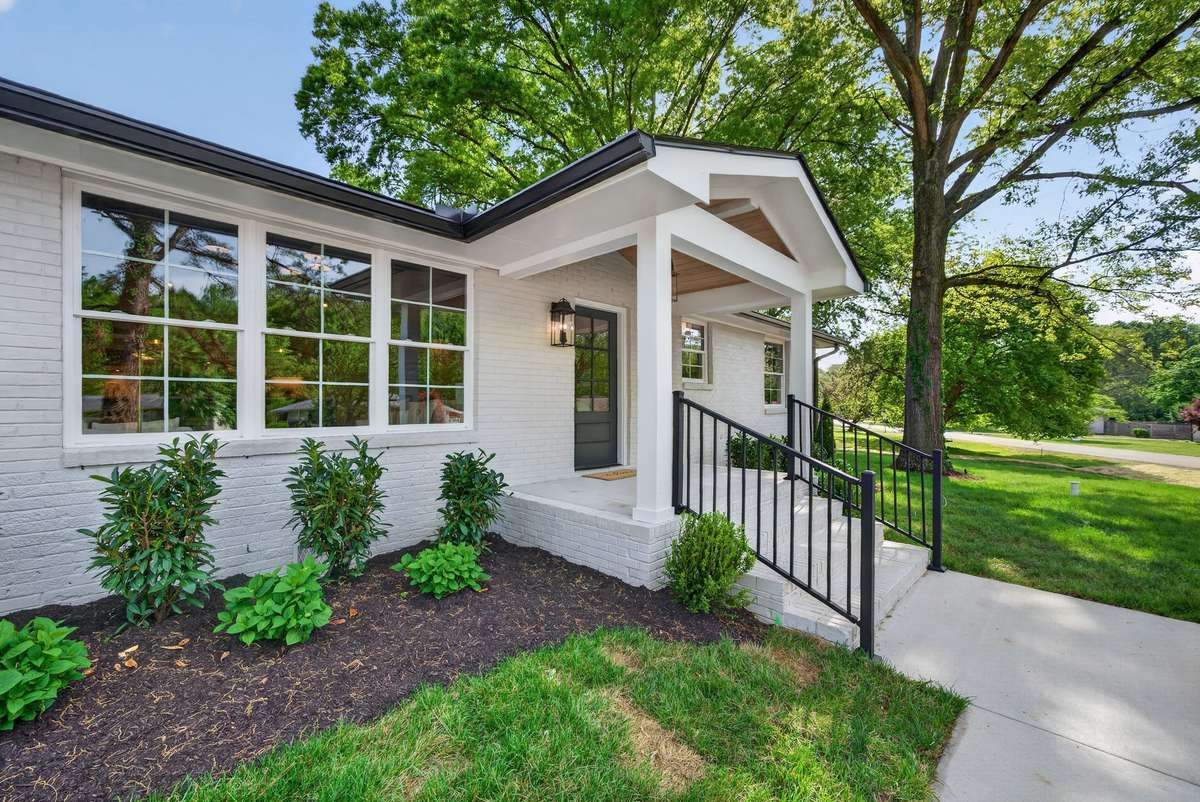 The front porch has been expanded to offer a proper welcoming entry to the home and includes a beautiful gas lantern.