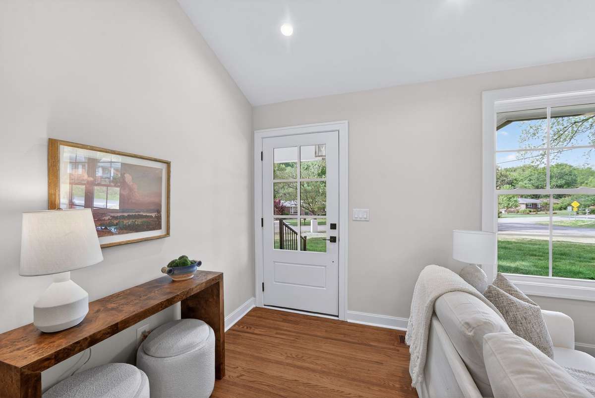 The entryway is bright and spacious with vaulted ceilings.