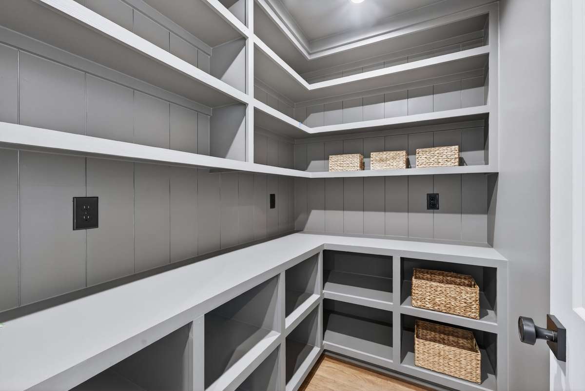 Spacious walk-in pantry right off the kitchen for additional storage