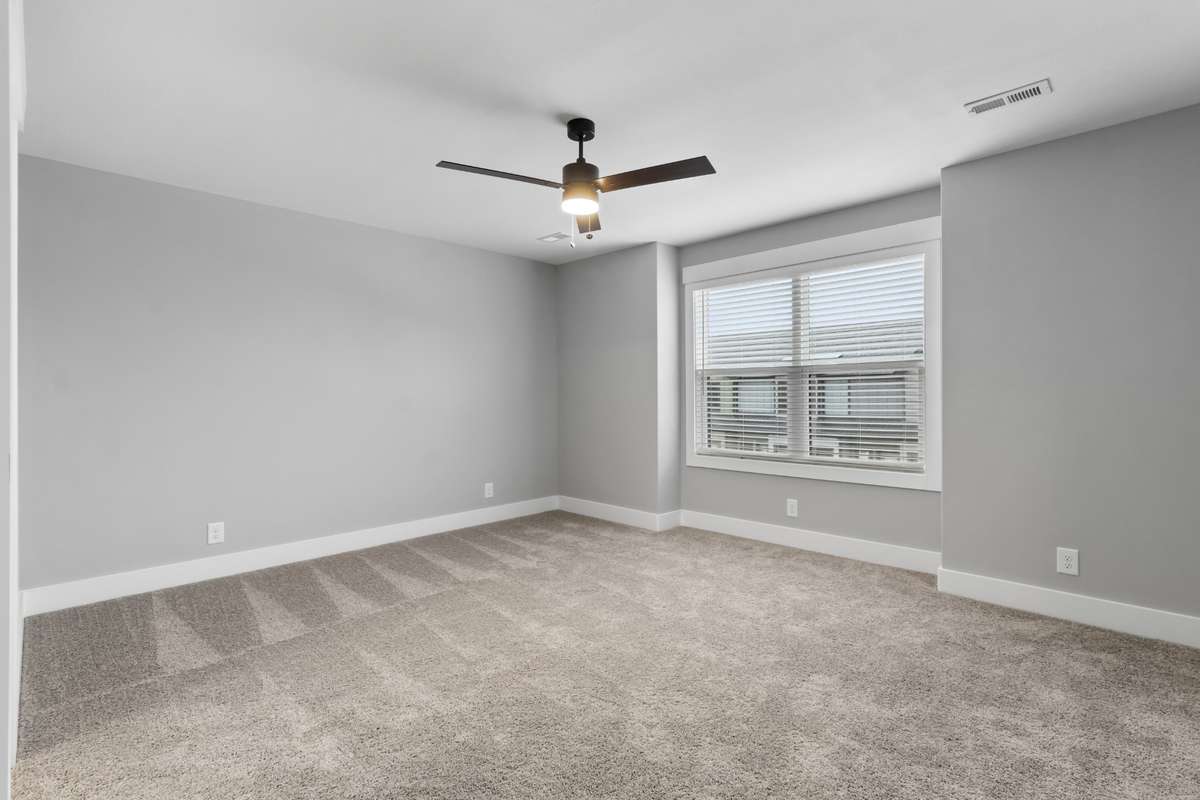 Oversized bedroom with attached full bathroom.