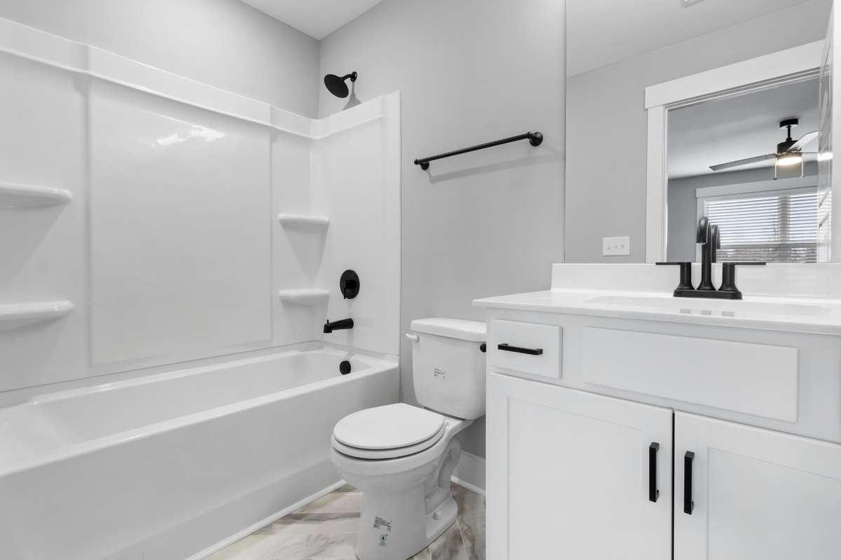 Attached bathroom features tile floors & upgraded fixtures.