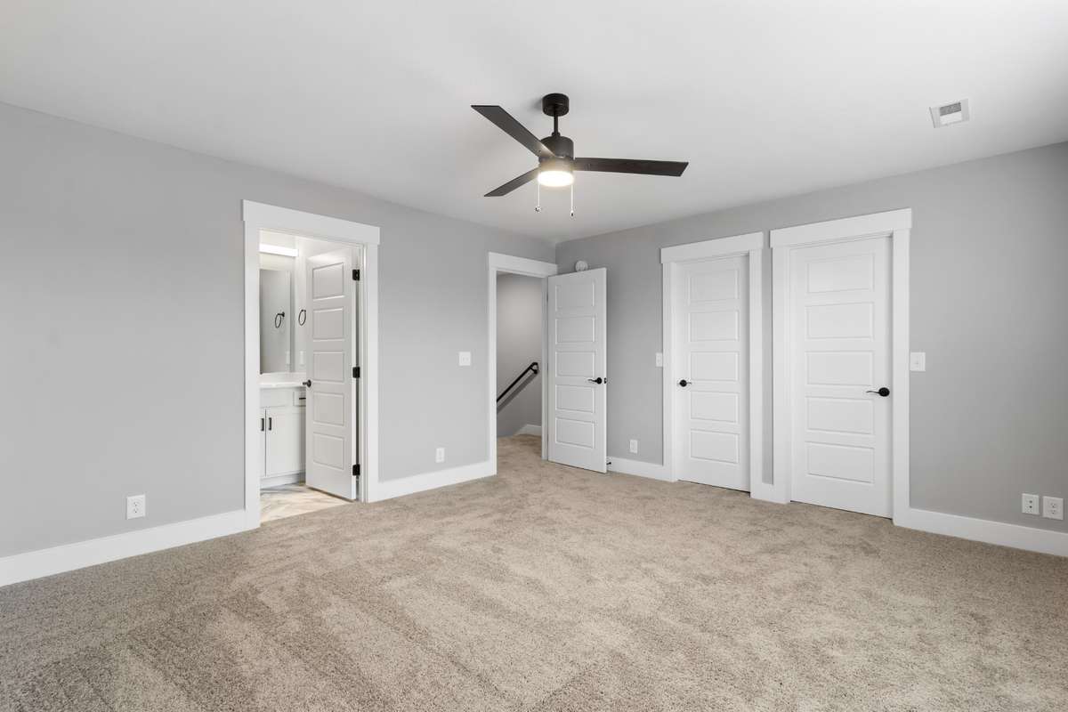 This bedroom includes two separate closets!