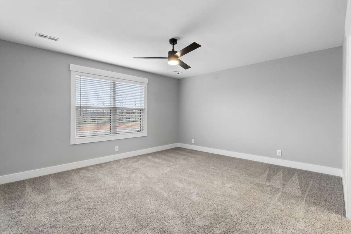 Another oversized bedroom upstairs with attached bathroom.