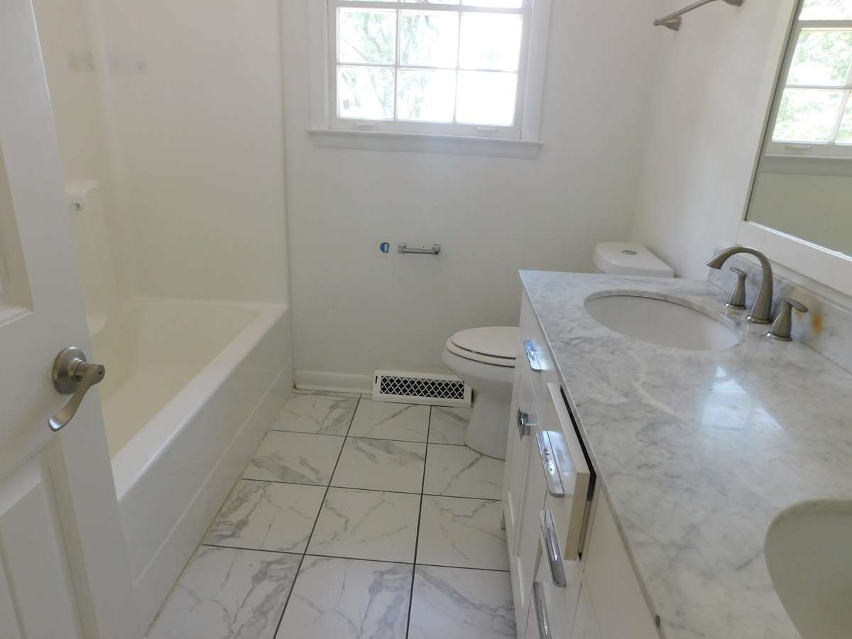 Full Bath upper level, New granite countertop, New cabinets, Combo Tub and shower