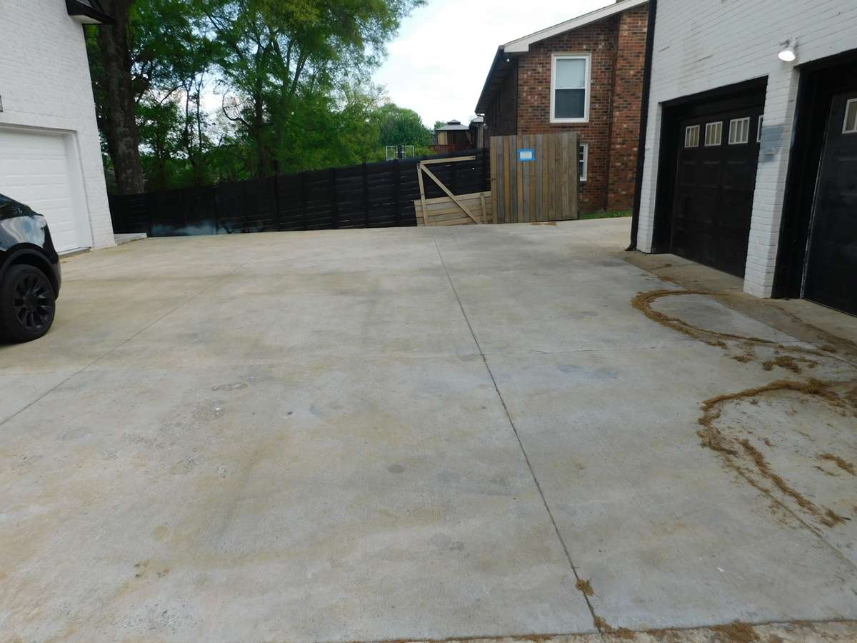 20 feet behind the garage (brown door)  is owned by the front house