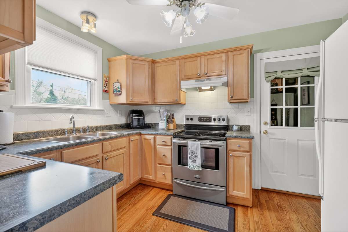 Kitchen with access to attached 1 car garage.