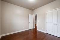 Bedroom 2 also has hardwoods and also makes a great office!