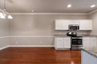 Granite counter tops and white cabinetry!