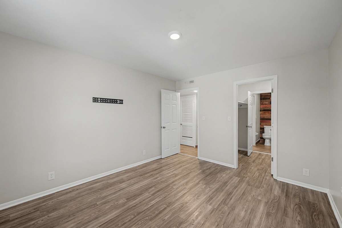 Primary bedroom. The walk through closet with w/d hookups leads to the bathroom