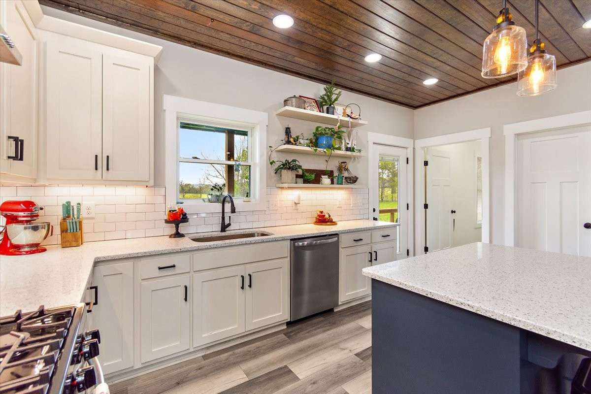 Another view of the kitchen which has a gas stove for the real chef in the house.