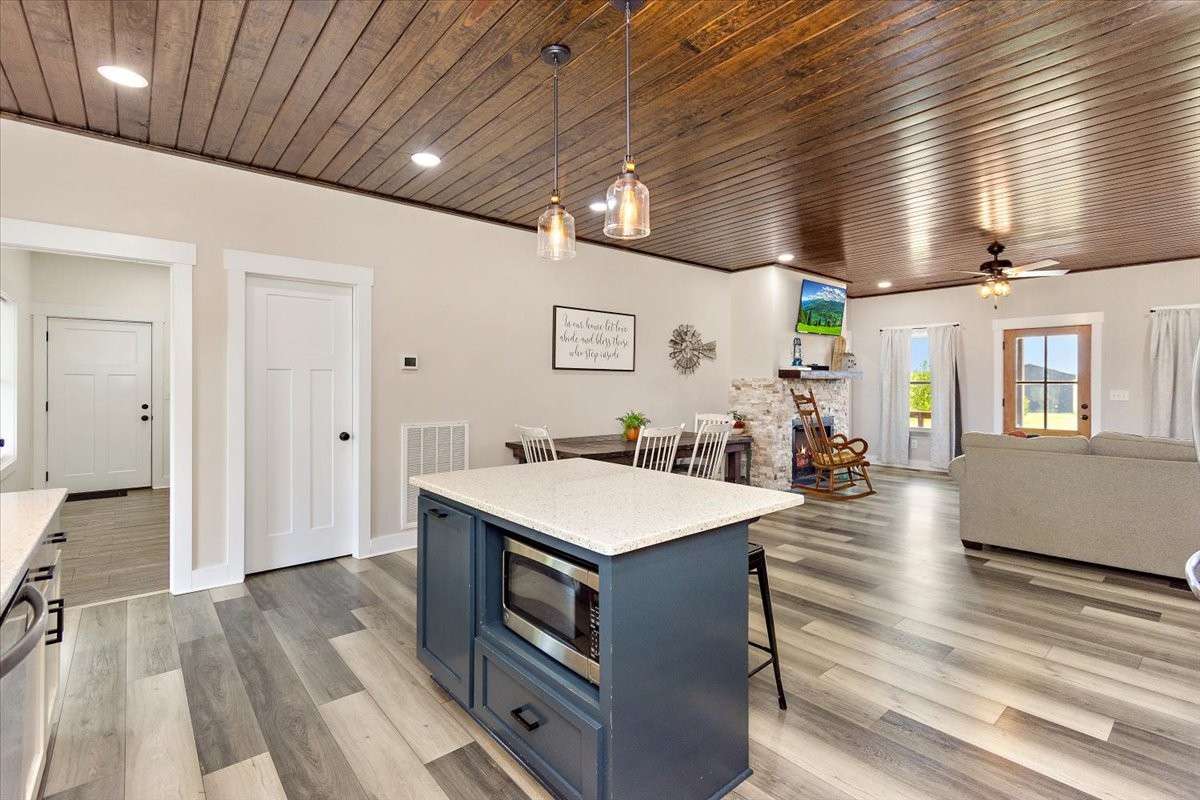 Another view of the island which has storage space in it and also holds the microwave.