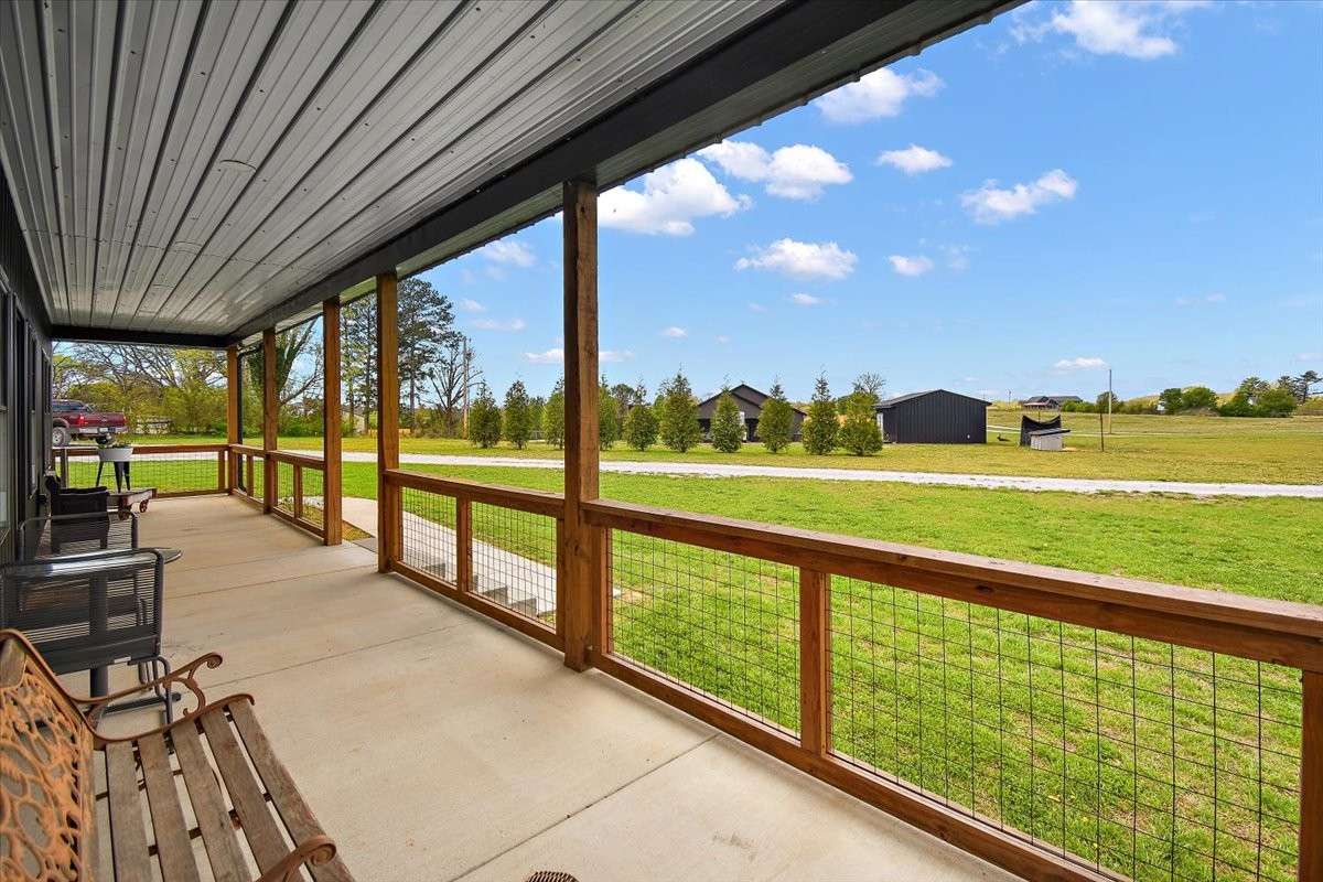This is the porch viewing our land and a neighbor in the distance.   It is so peaceful here.