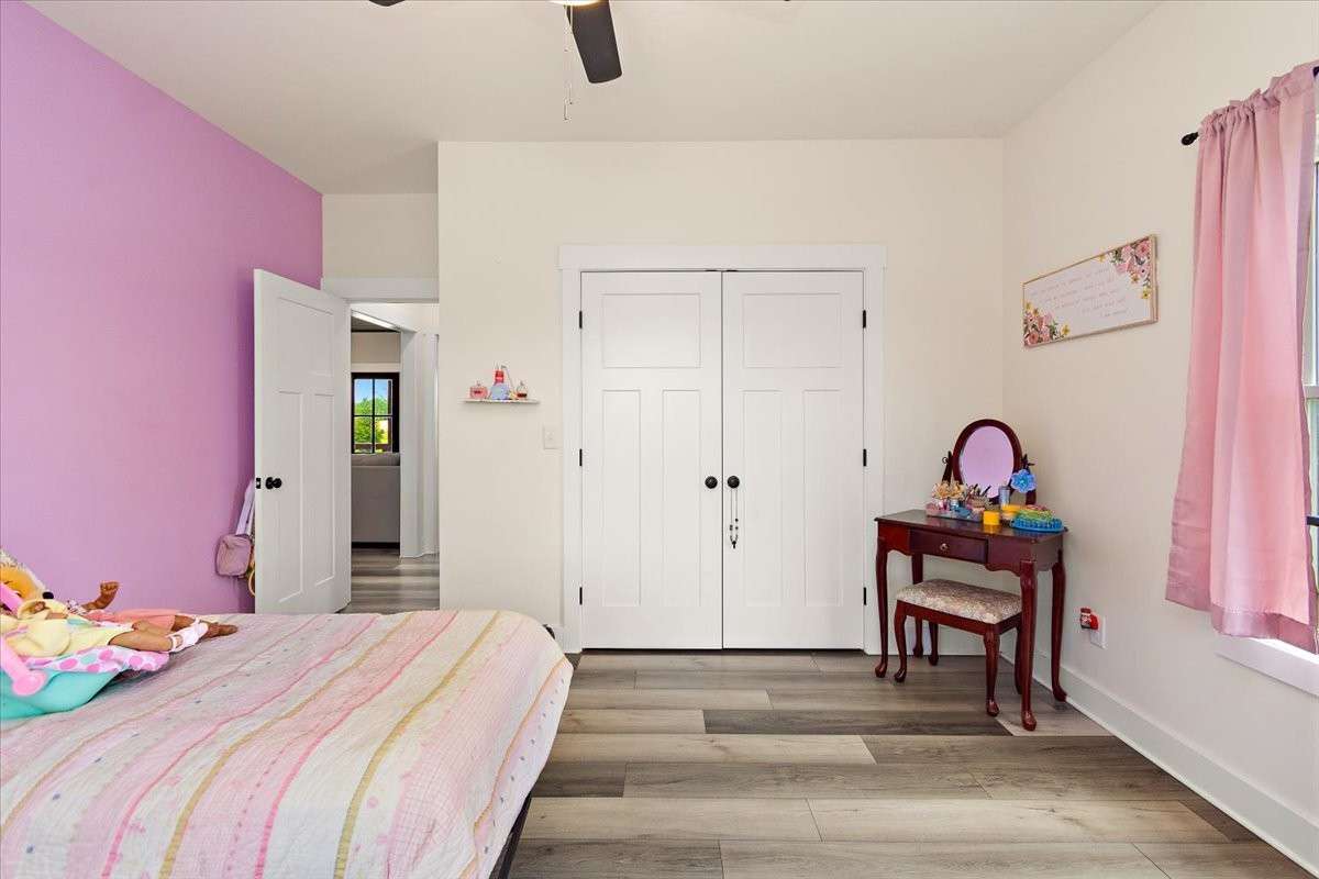 Another view of the 3rd bedroom showing the closet and the door.