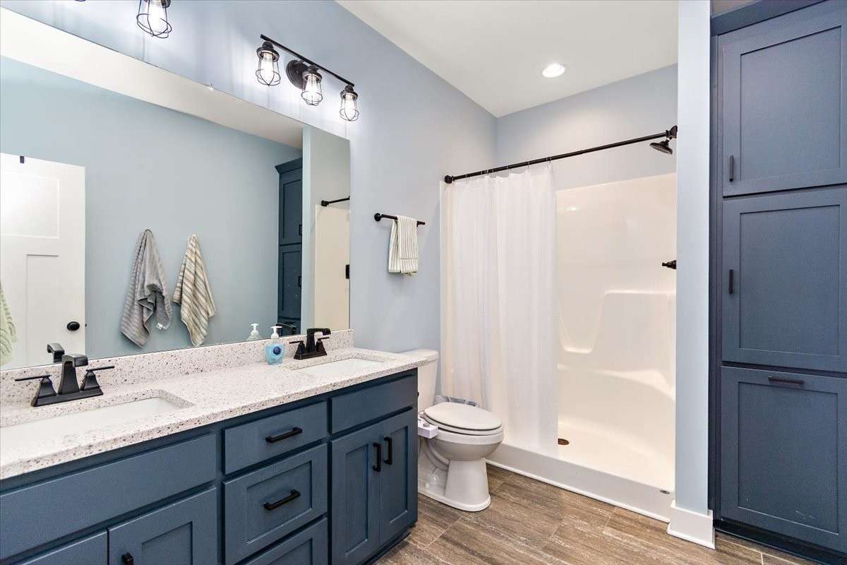 This is the Master Bathroom with double sinks, lots of storage, and a walk-in shower.