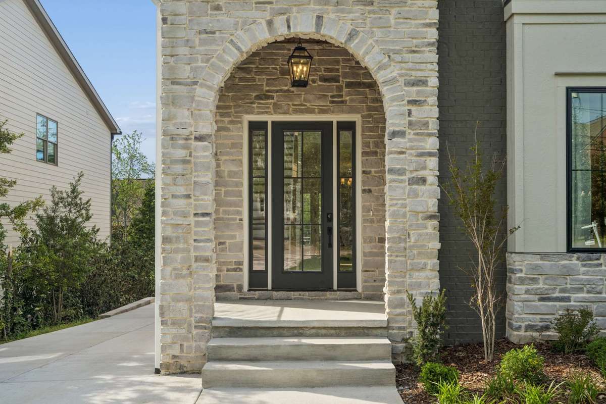 Enjoy the timeless charm of the stone-accented exterior