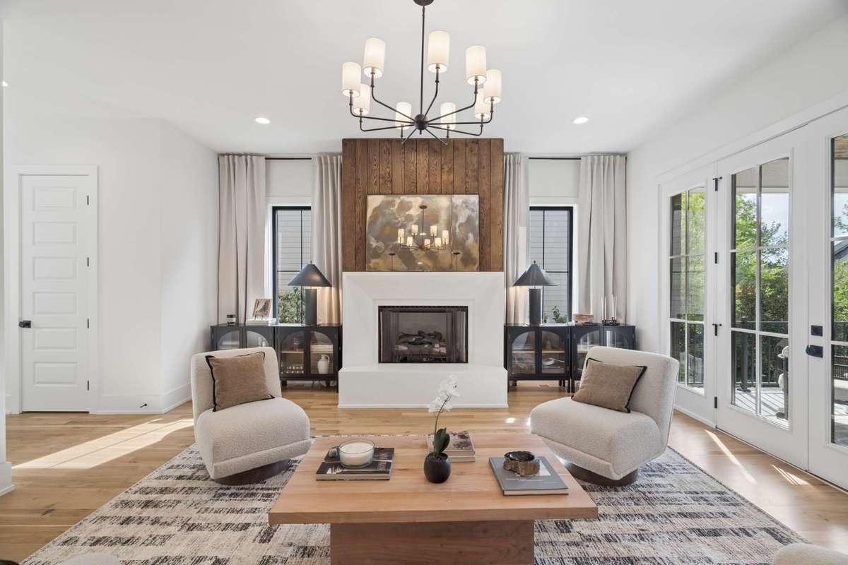 Enjoy the stunning handmade designer fireplace and custom wood surround