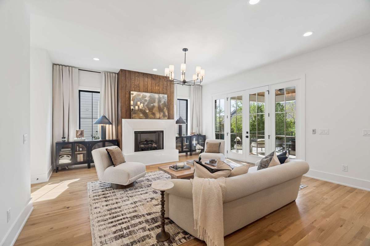 Bathed in natural light, this home features oversized windows in every room