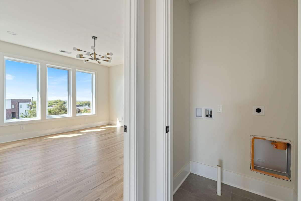 Bedroom and stacked laundry closet on 3rd floor.