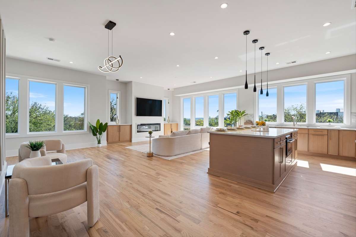 Very open layout with large 6 & 8 foot windows with 10 foot ceilings & 4" can lights.